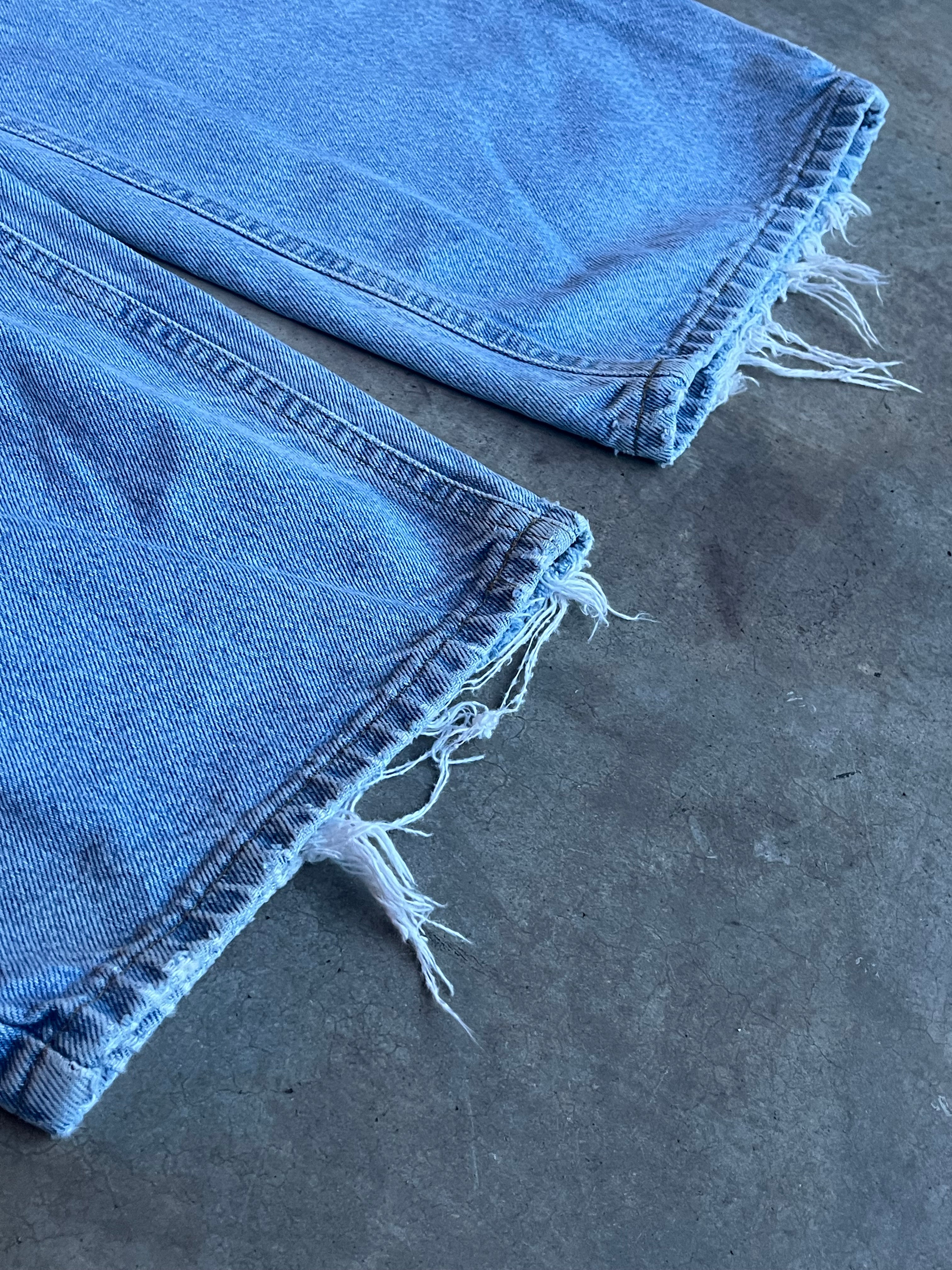 Light-wash Carhartt Jeans with rips and distressing- 44x32